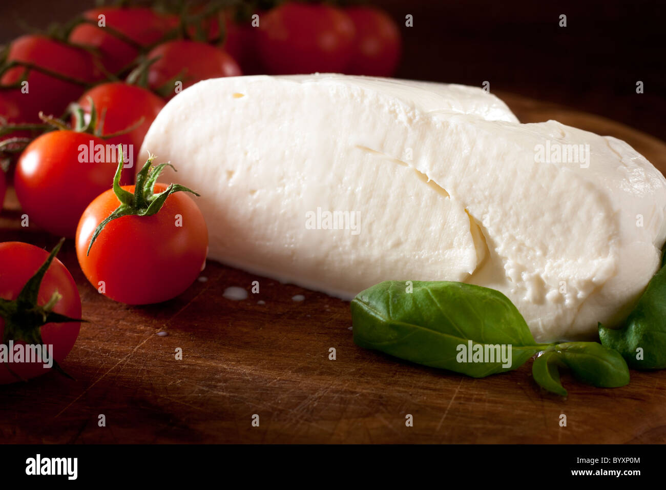 Mozzarella with Tomatoes and Basil Stock Photo - Alamy