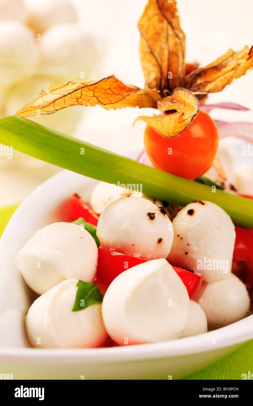 Bowl of mozzarella cheese, tomato and basil Stock Photo - Alamy