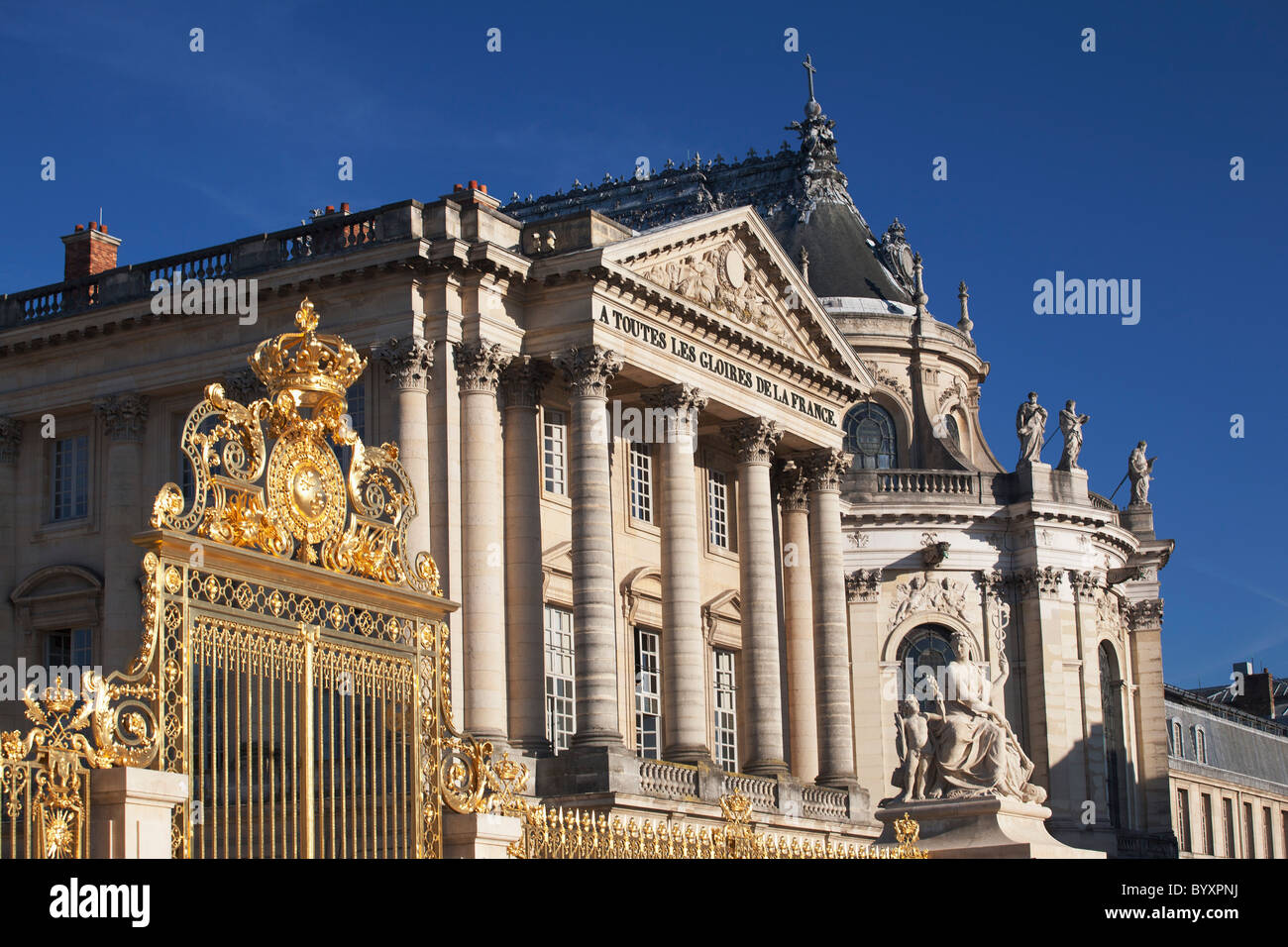 gold gates and an opera house and chapel; paris, france Stock Photo