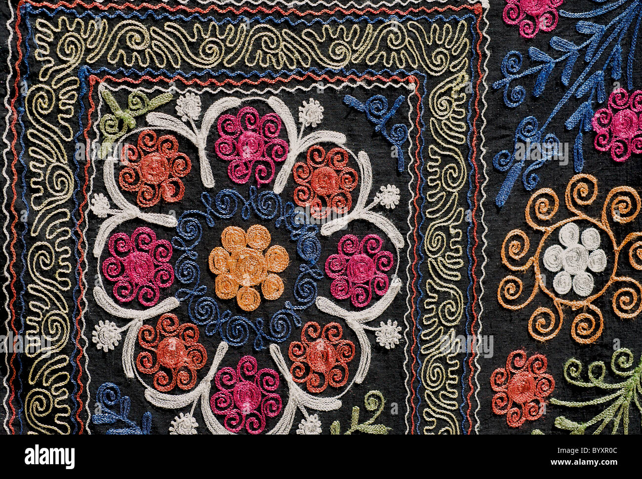 Detail of embroidered textile for sale at market, Khiva, Uzbekistan. Suzani Stock Photo