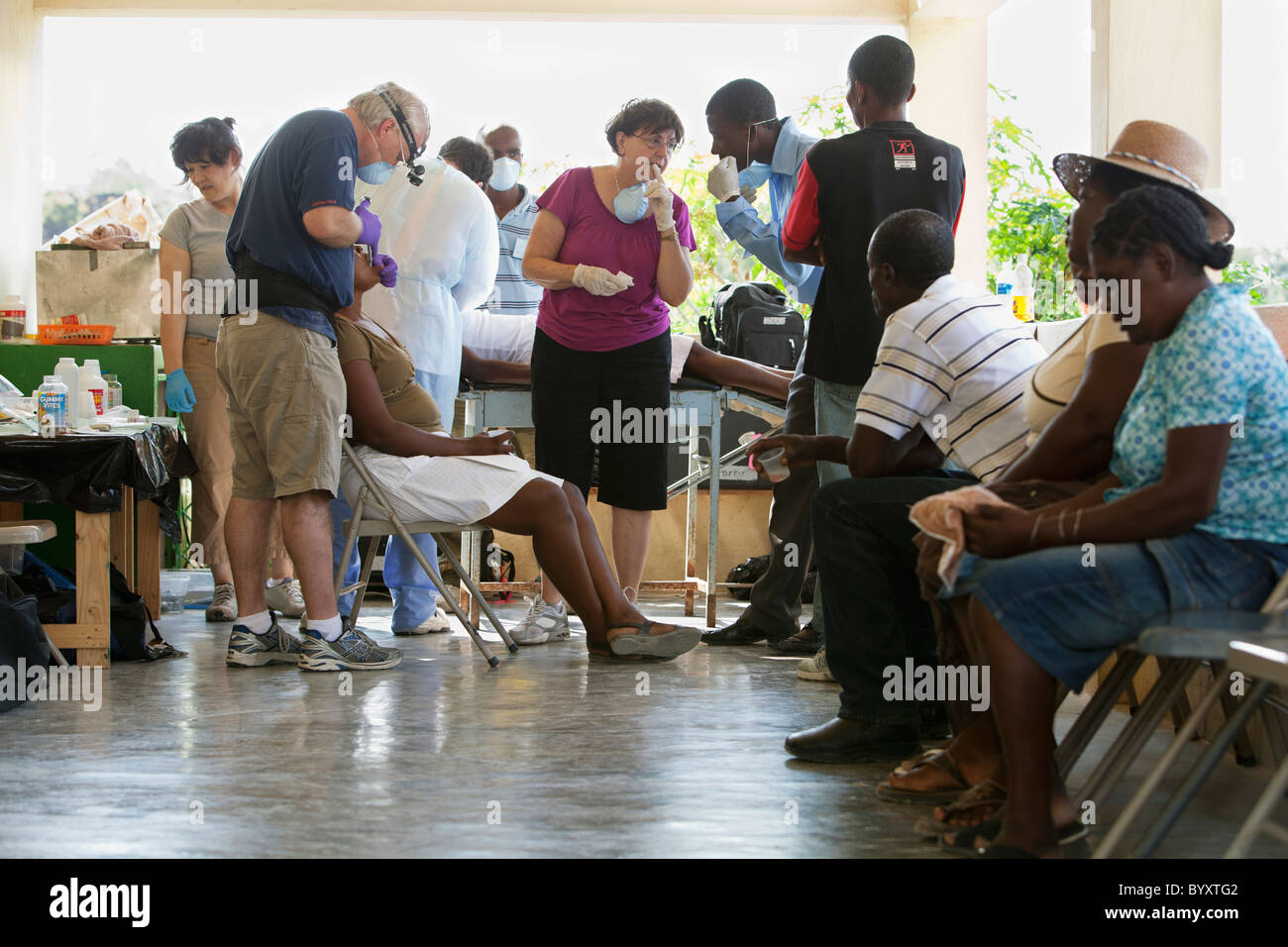 a dentist volunteers his dentistry to help haitian people who are
