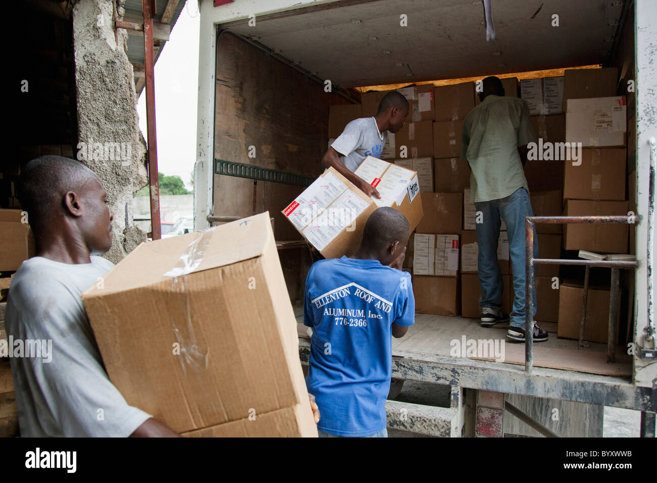 men loading boxes into a truck; port-au-prince, haiti Stock Photo