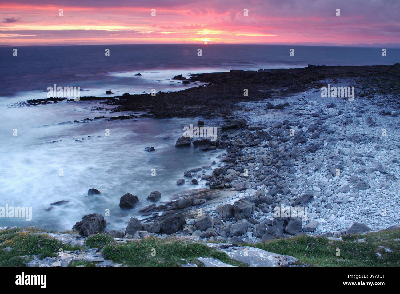 sunset over the burren in munster region; county clare, ireland Stock Photo