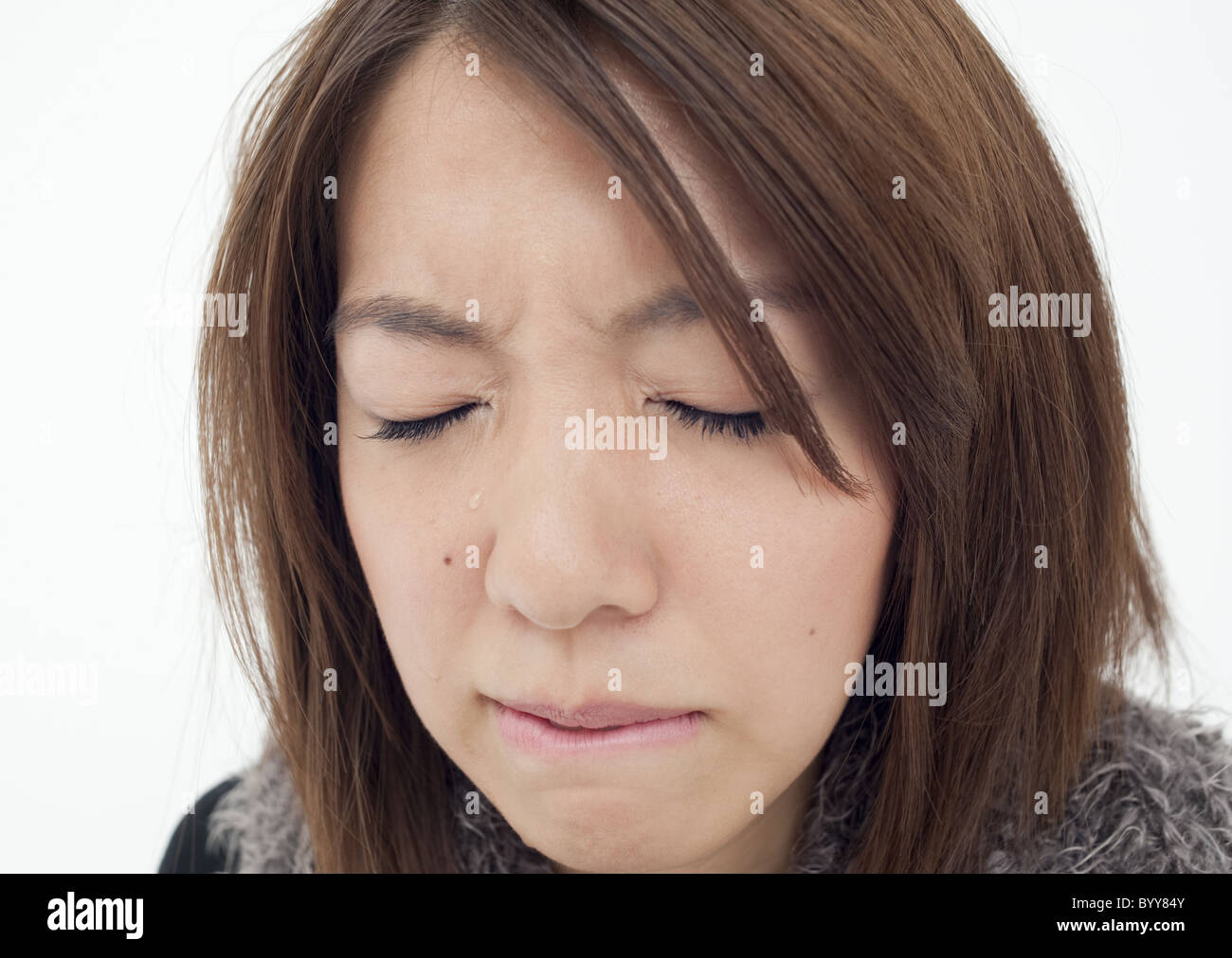 Young woman shedding tears Stock Photo Alamy