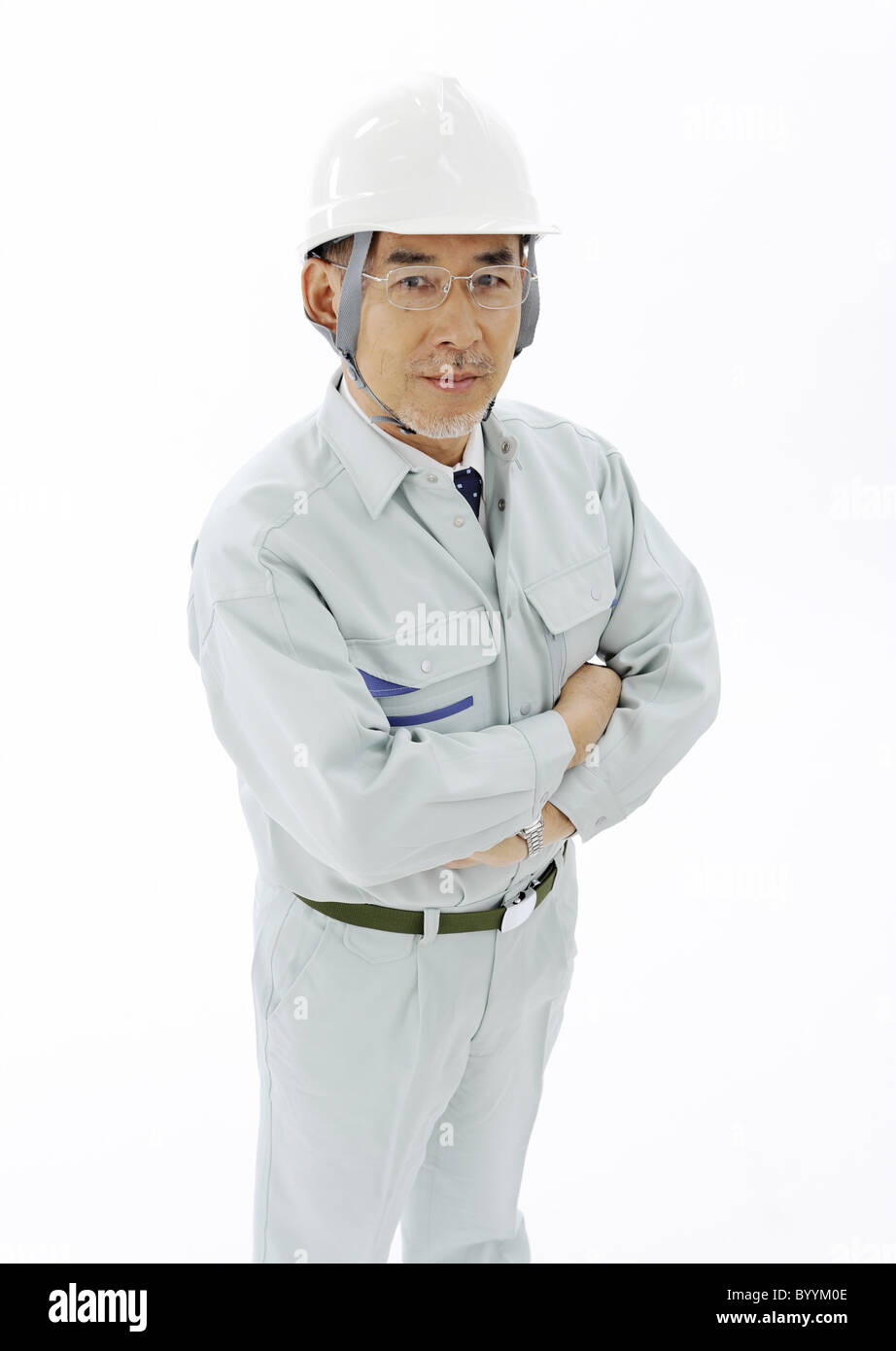 Worker folding his arms Stock Photo Alamy