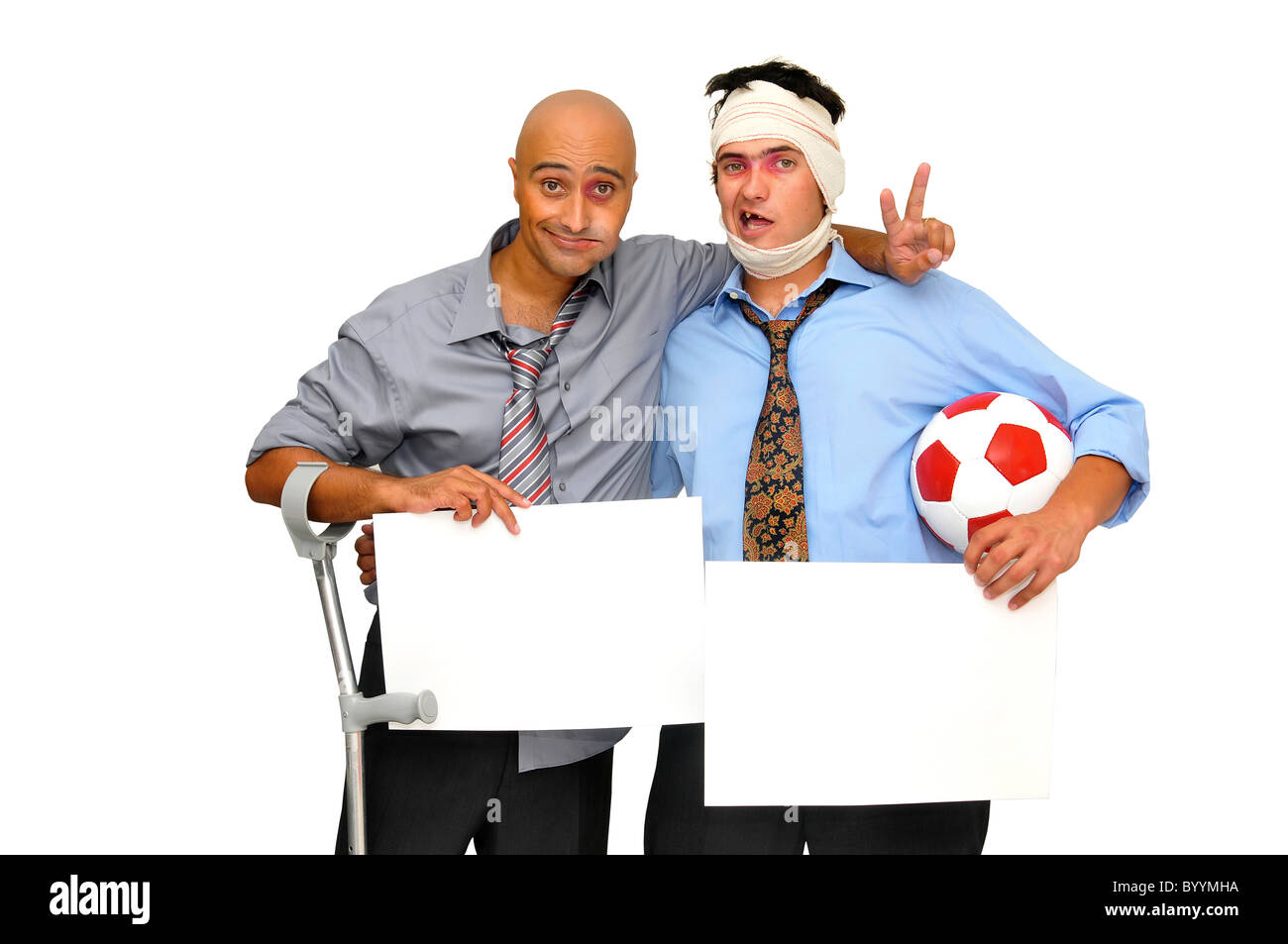 Two badly injured businessmen after a soccer match with empty cards , isolated in white Stock Photo