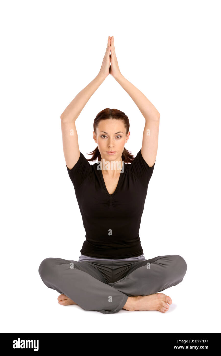 Pretty young woman practicing yoga sitting asana, isolated on white background Stock Photo
