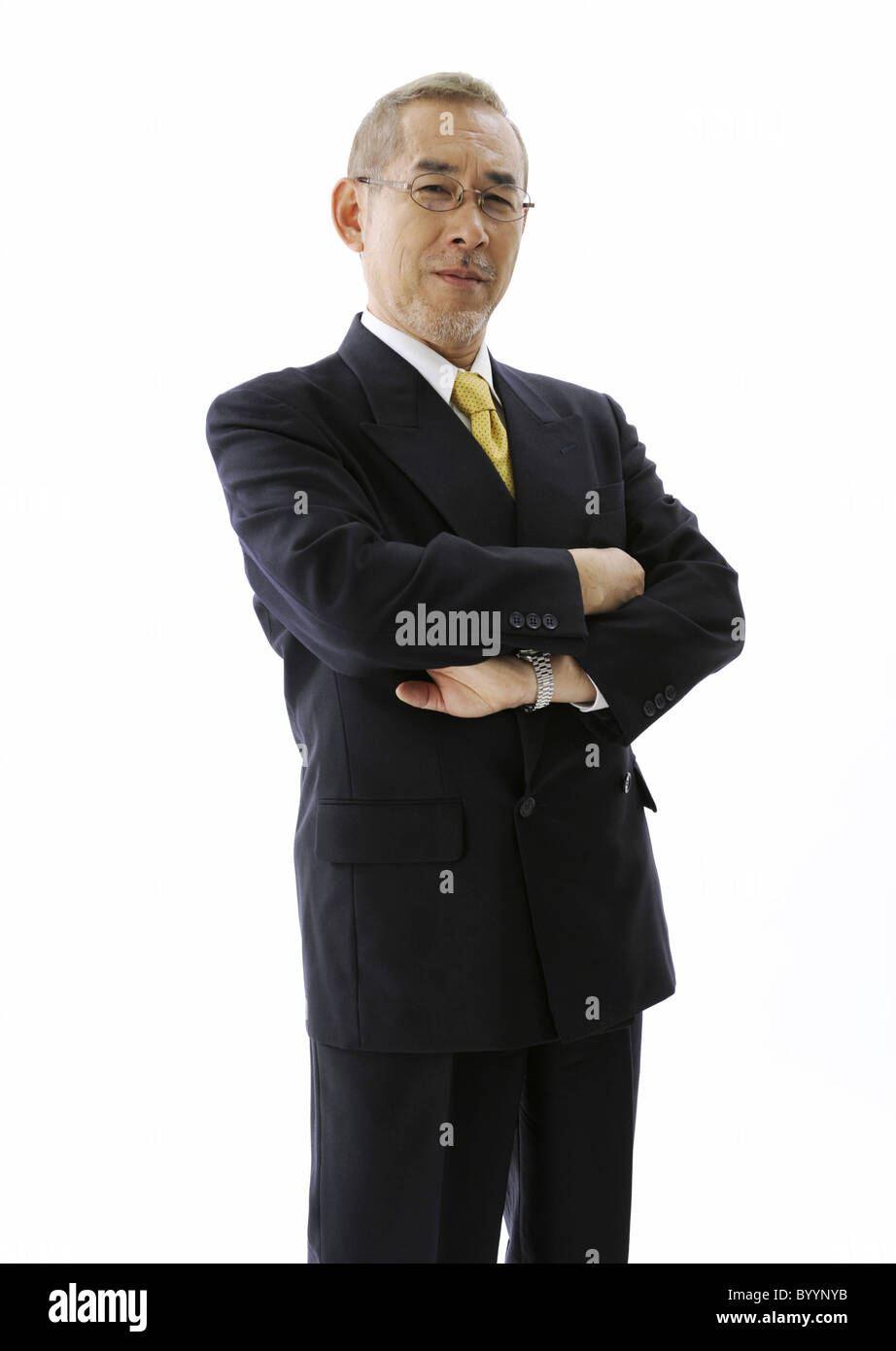 Businessman folding his arms Stock Photo