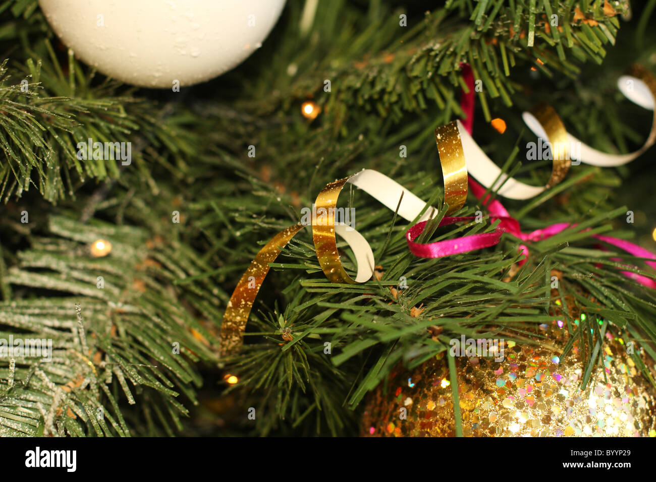 Bright festive balls on a Christmas tree Stock Photo - Alamy