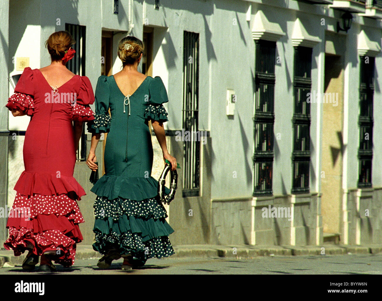 Two Spanish ladies in traditional dress during a village festival in Andalusian village of Alozaina. Stock Photo