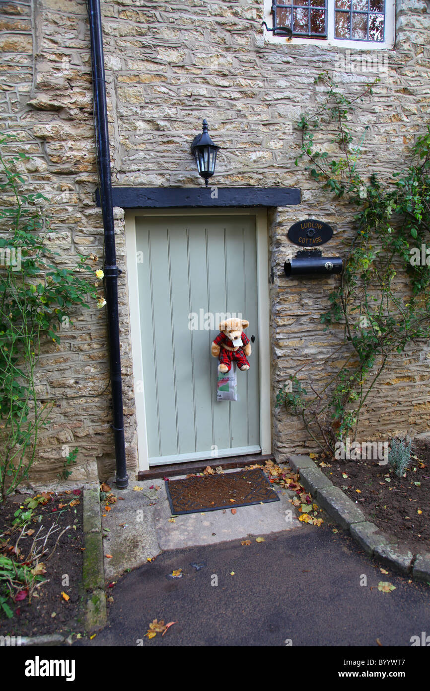 Do Not Disturb Teddy on cottage door Stock Photo