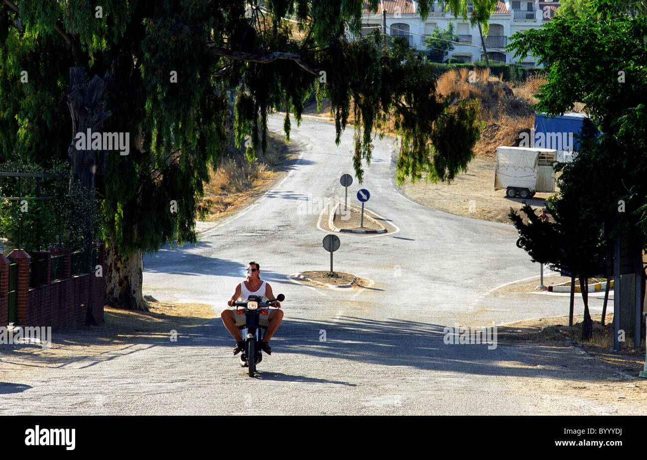 Motorcylclist touring the road of Andalucia Spain Stock Photo