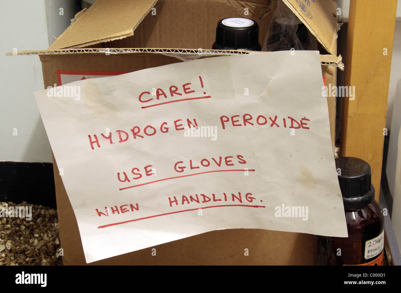 Warning sign on a container of hydrogen peroxide in a school chemical