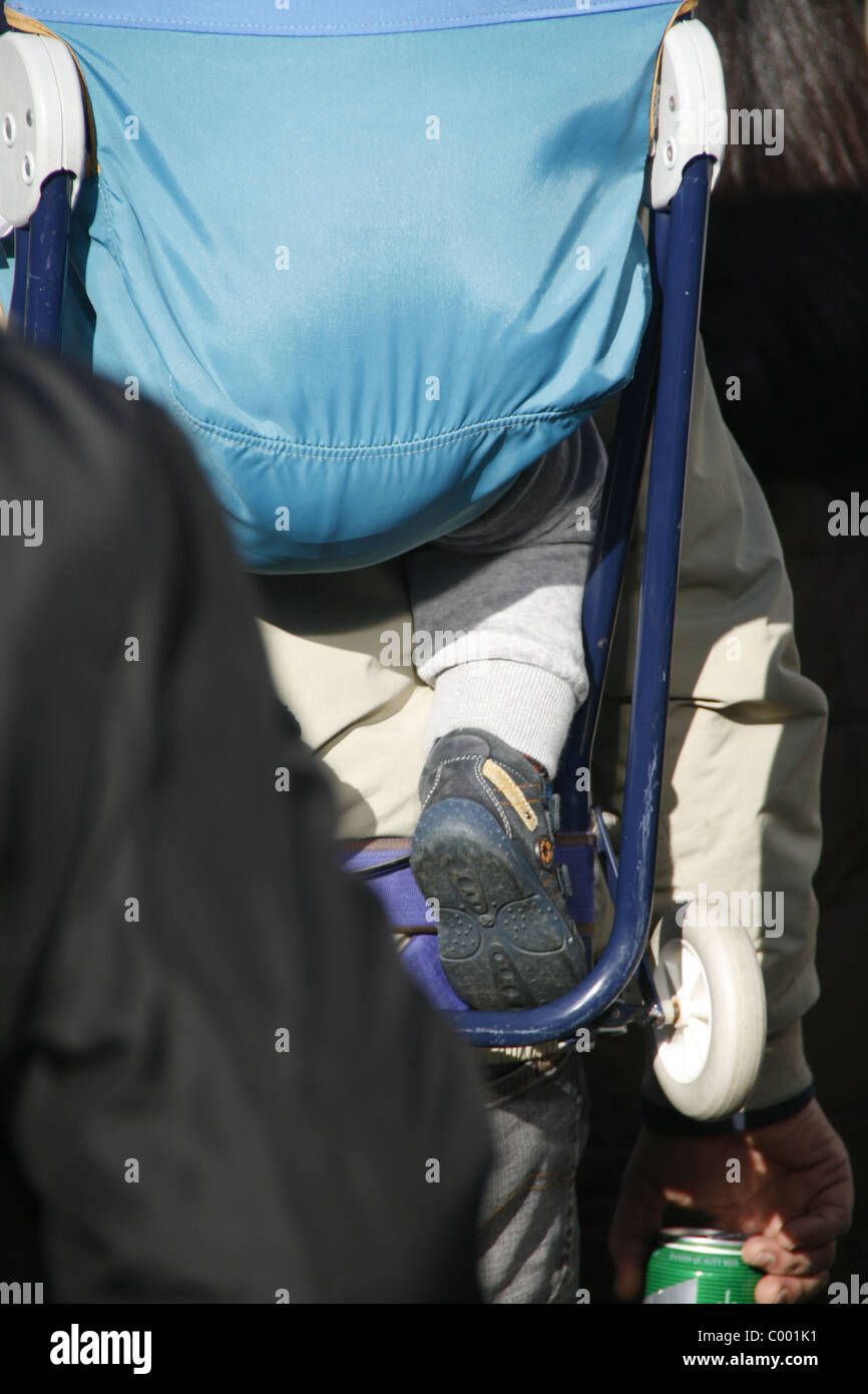 baby being carried in backpack carrier on shoulders Stock Photo Alamy