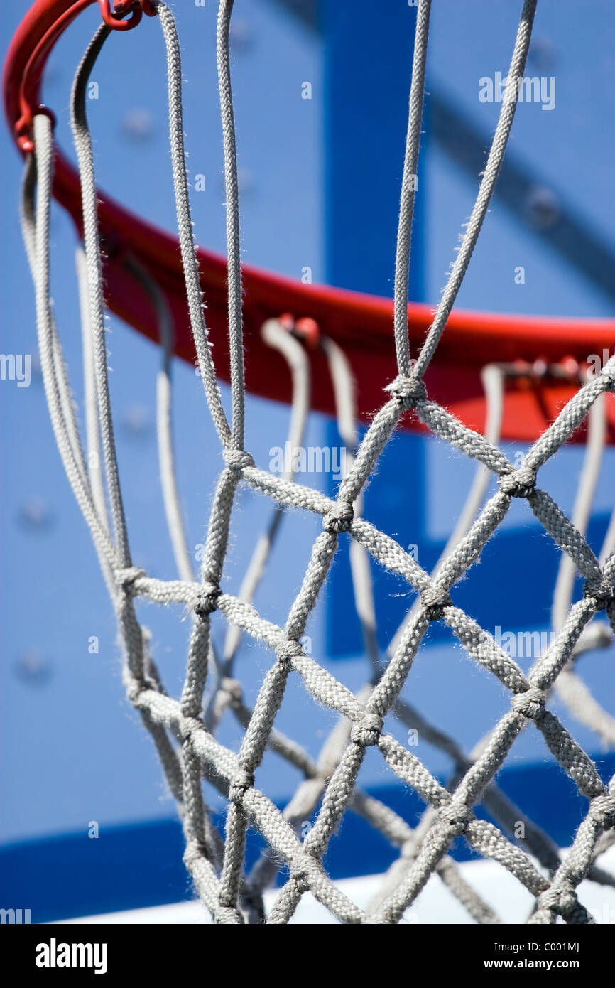 Closeup detail of a playground basketball goal and net. Shallow depth