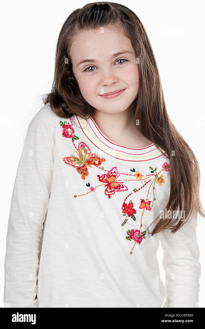 Shot of a Eight Year Old Brunette Girl against White Stock Photo
