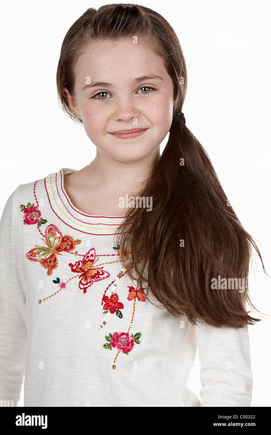 Shot of a Eight Year Old Brunette Girl against White Stock Photo