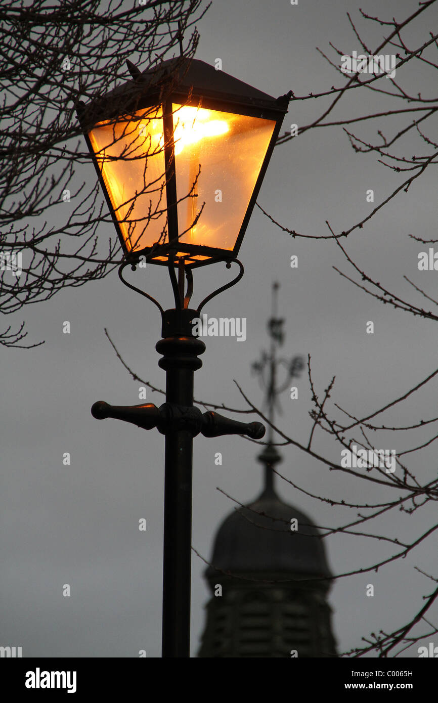 Old style street lighting with electric bulbs. Stock Photo