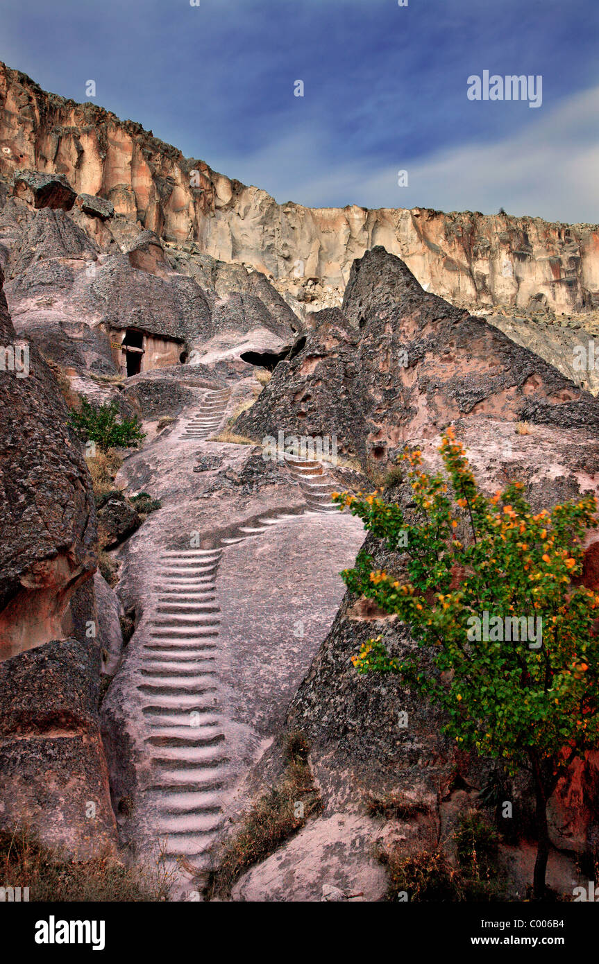 The steep, worn, carved steps that lead to rock cut Tokali Kilise (Buckle Church), Soganli valley, Kayseri, Cappadocia, Turkey Stock Photo