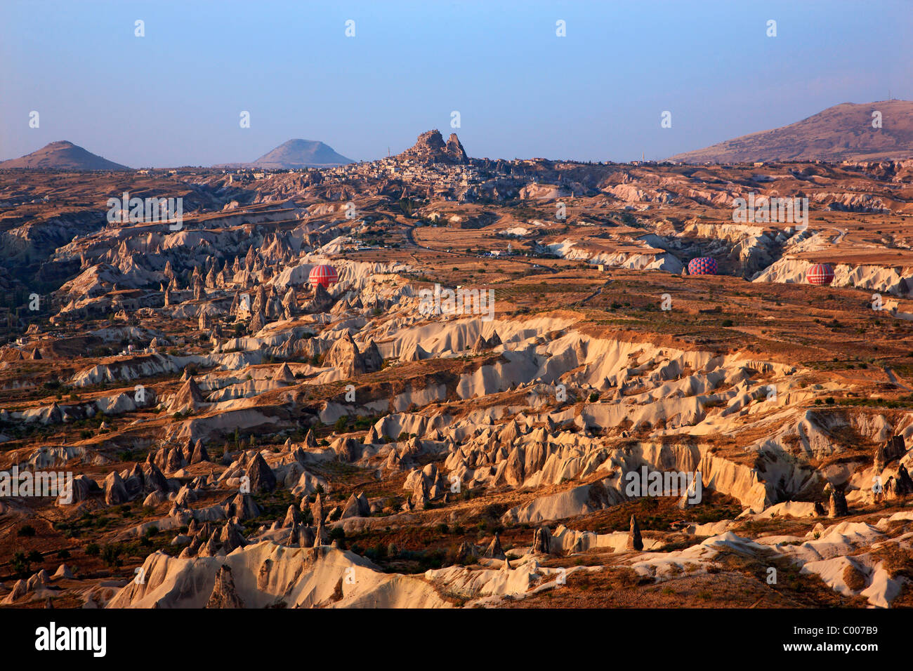 Hot air baloon flight over Cappadocia, over Pigeon valley, to be more exact. In the background Uchisar town. Turkey Stock Photo