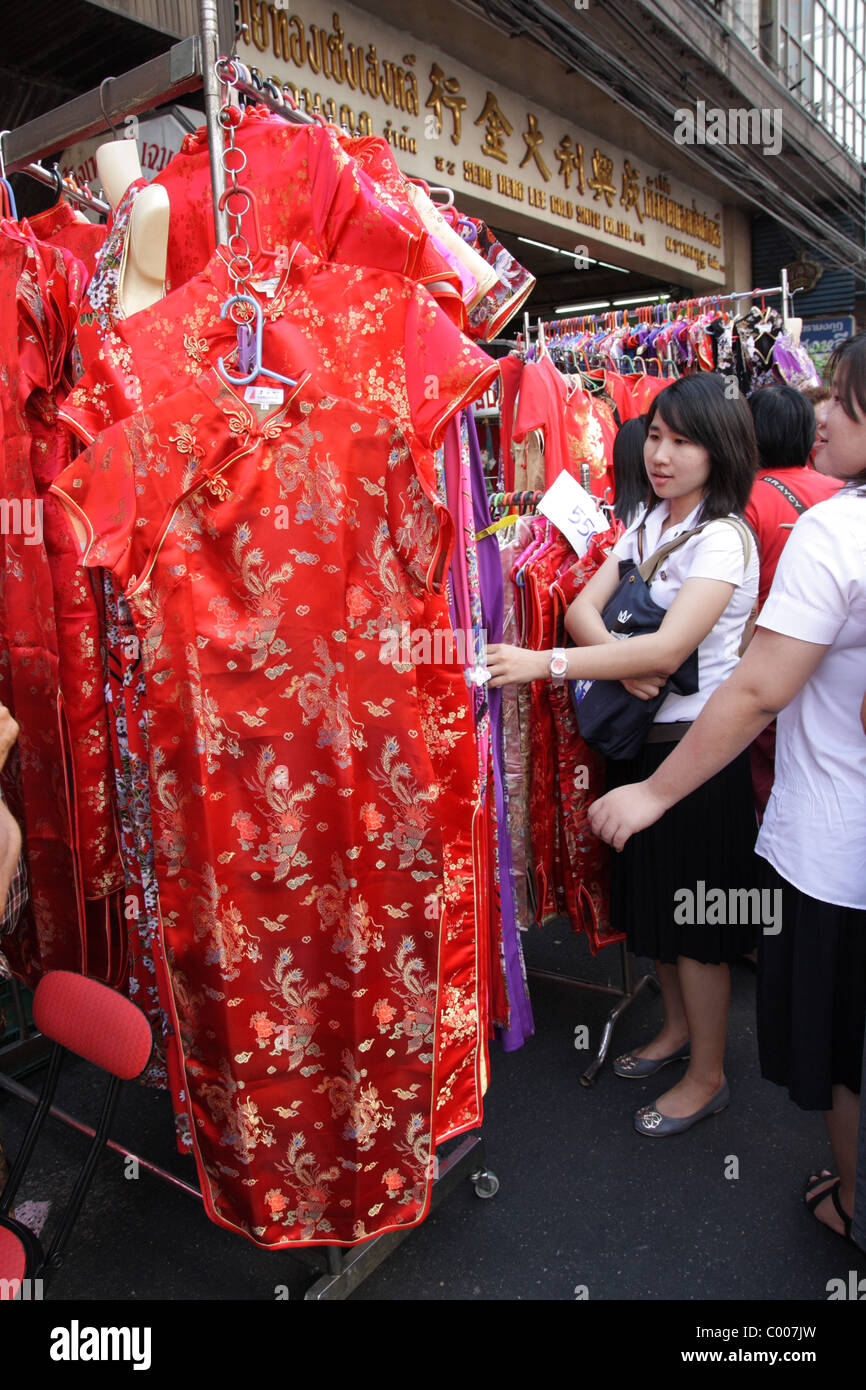 Thai woman choosing Chinese traditional dress Stock Photo