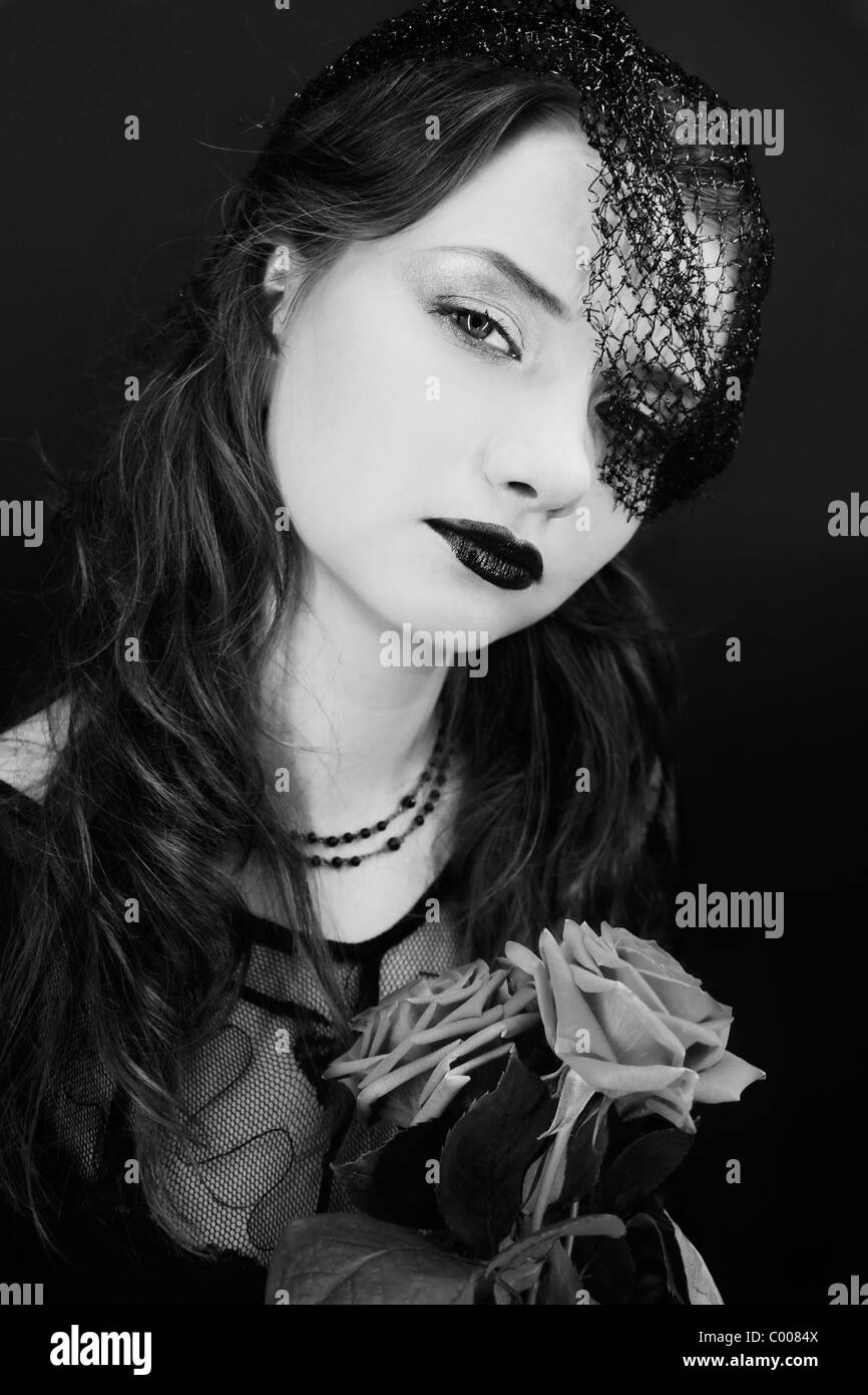 portrait of woman in the veil with a bouquet of roses Stock Photo - Alamy