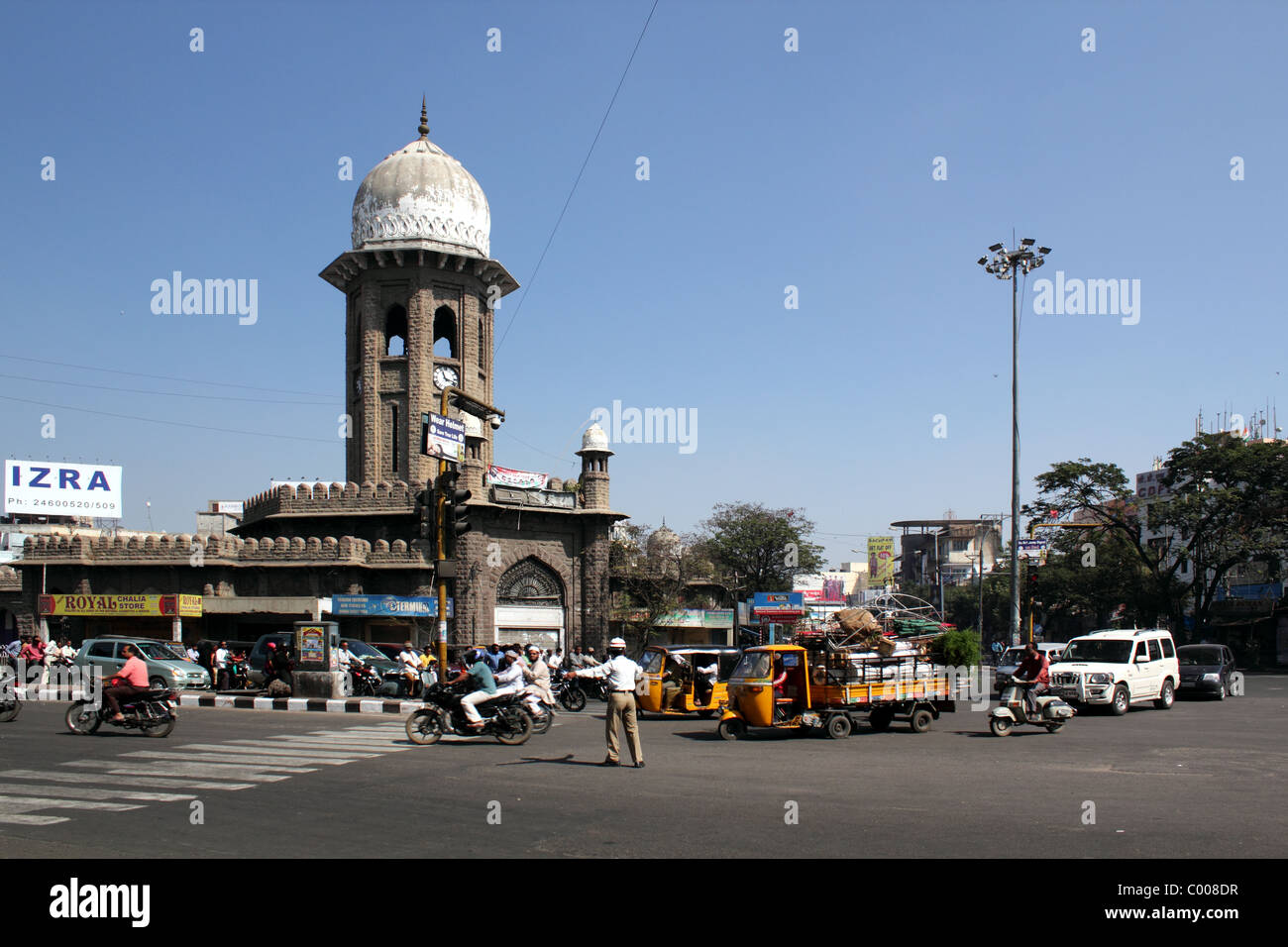 Landscape view of  policeman directing traffic in front of Mozamjahi Market, Hyderabad India Stock Photo