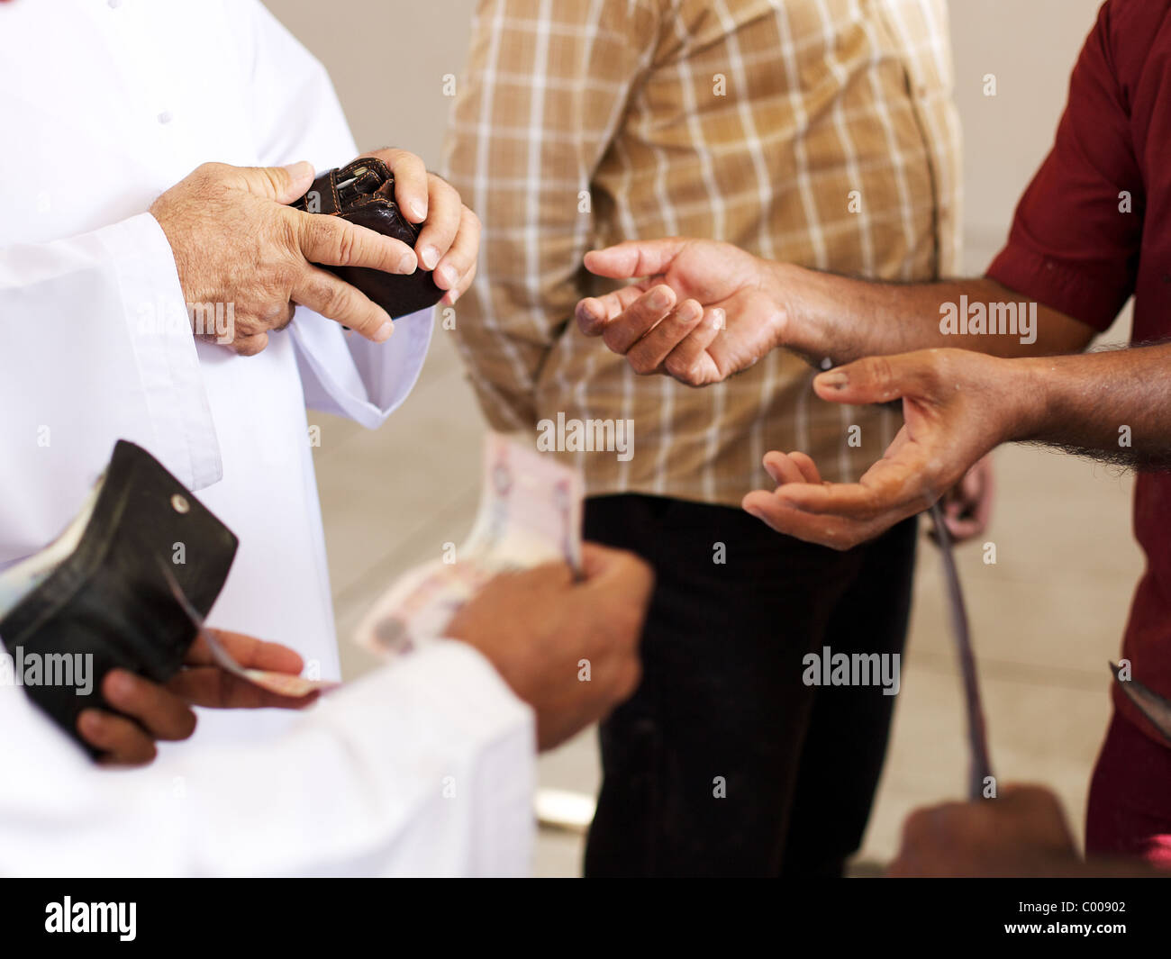 Money changing hands, Dubai, UAE Stock Photo Alamy