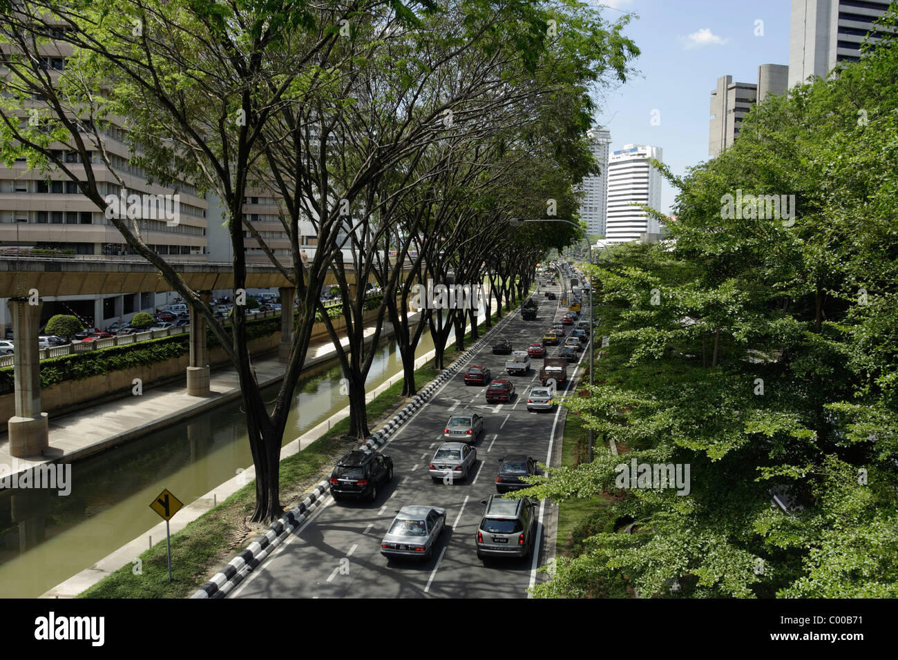 Tree lined street in Kuala Lumpur, Malaysia Stock Photo
