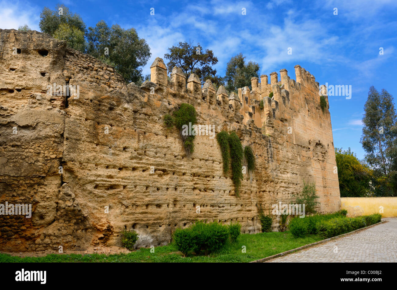 Ancient crenelated rampart wall of Bab el Seba in Fes el Jedid Fez Morocco Stock Photo