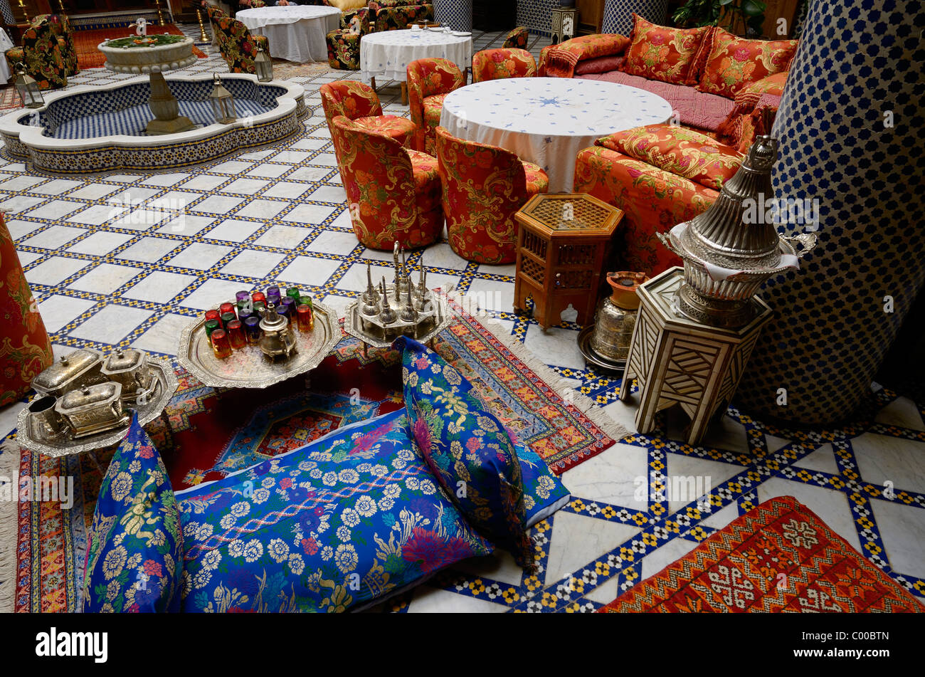 Tea set and dining area in Moorish style inside Riad El Yacout in Fes el Bali Morocco Stock Photo