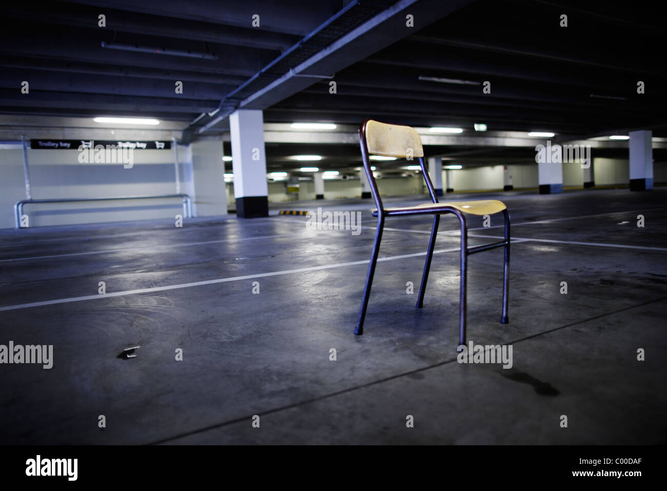 Empty chair in empty carpark. Stock Photo