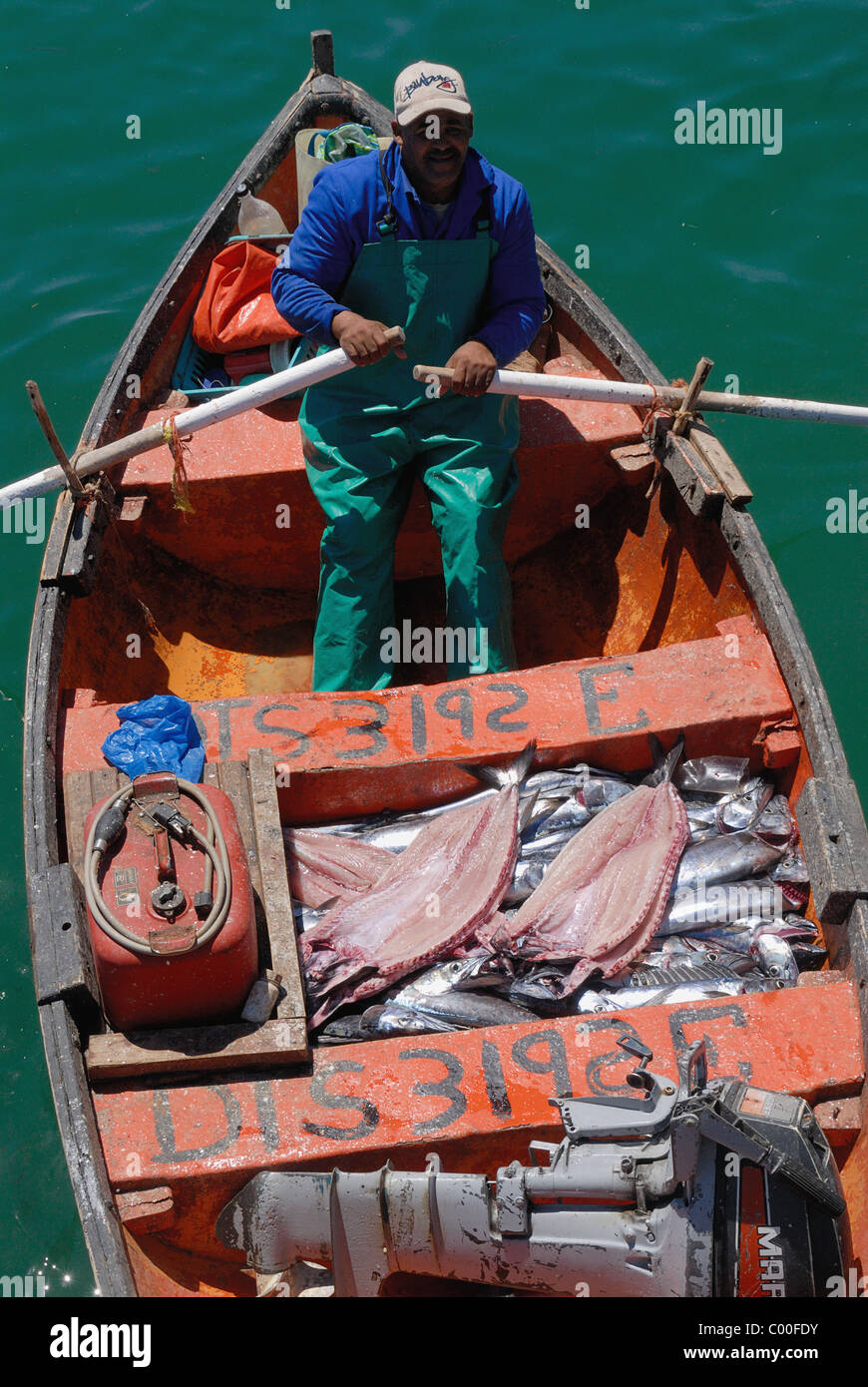 Fisherman waiting to land his catch Stock Photo Alamy