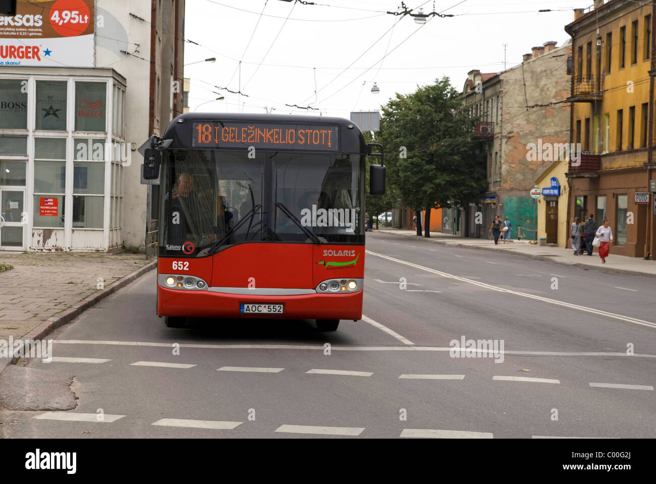 Red trolleybus in the streets of Kaunas, Lithuania Stock Photo