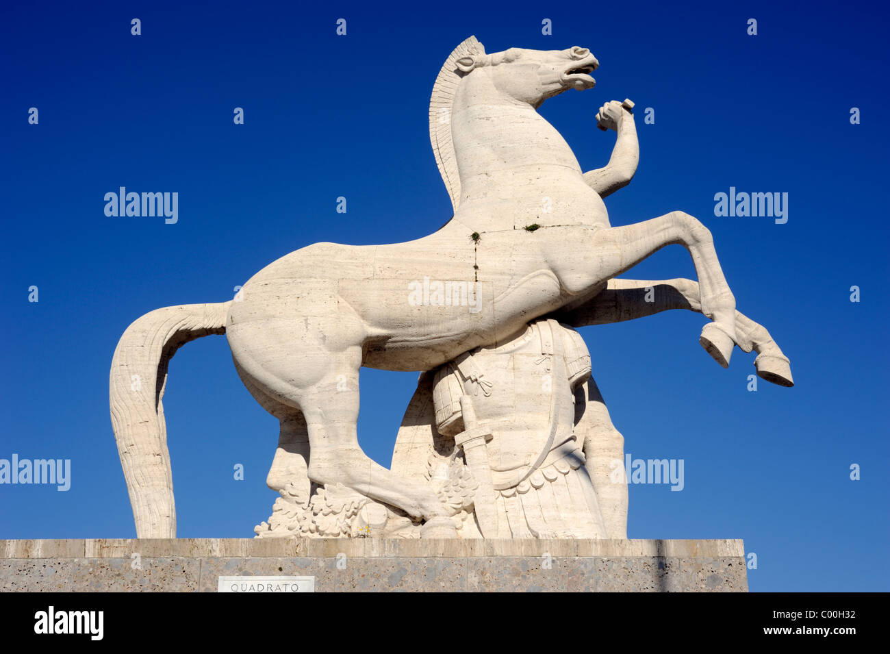Italy, Rome, Eur, Palazzo della Civiltà del Lavoro, horse statue Stock Photo