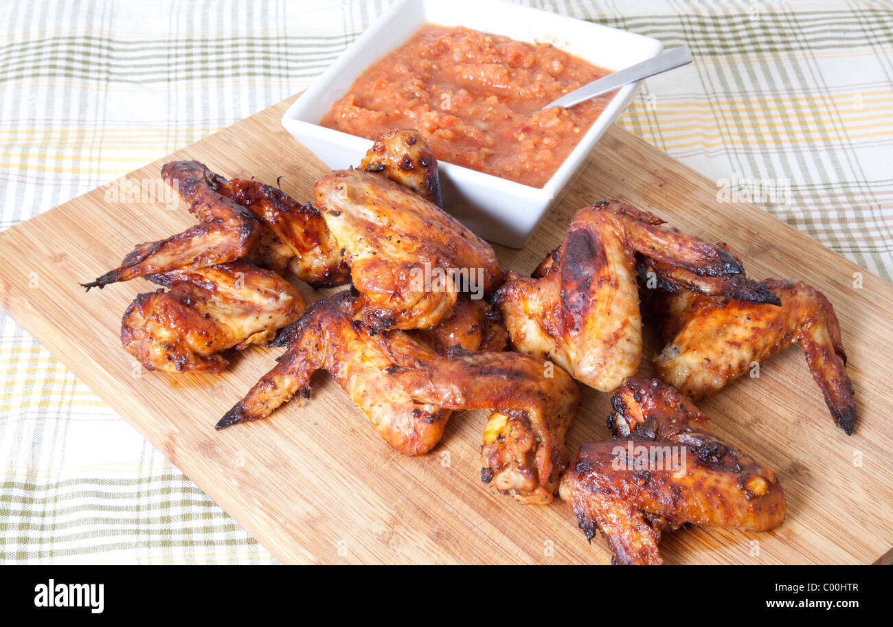 Chicken wings with fresh tomato sauce Stock Photo
