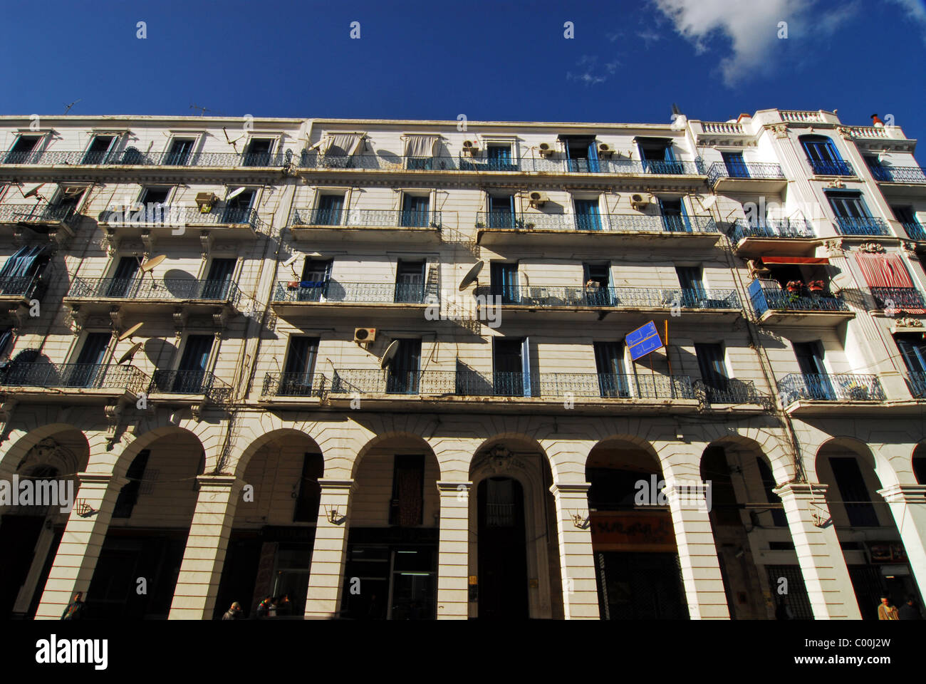 Algeria, Algiers, low angle view of an apartment building with arcade