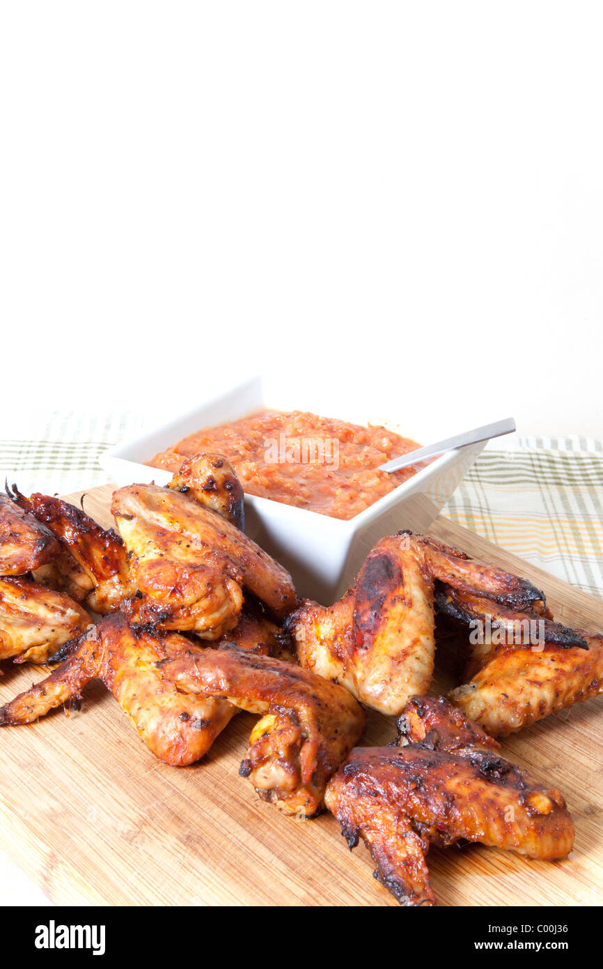 Chicken wings with fresh tomato sauce Stock Photo