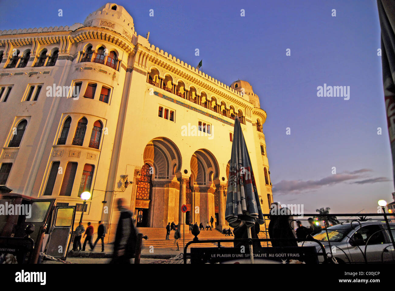 Algeria, Alger, low angle view of people by post office building against sky at dusk Stock Photo