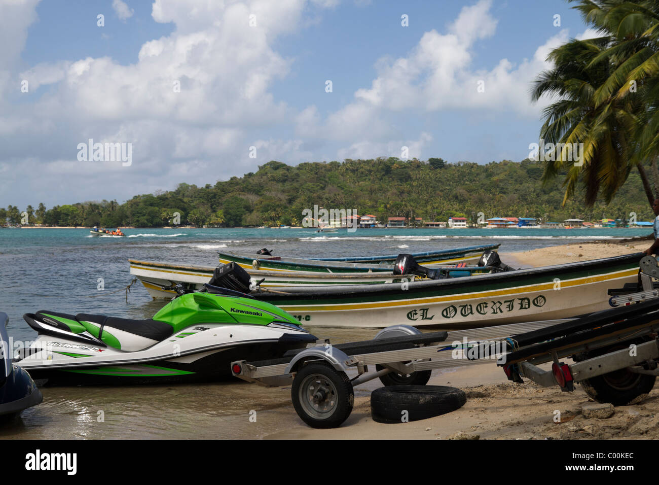 Boats and marine motorcycles at La Guaria with Isla Grande on the background. Colon, Republic of Panama, Central America Stock Photo