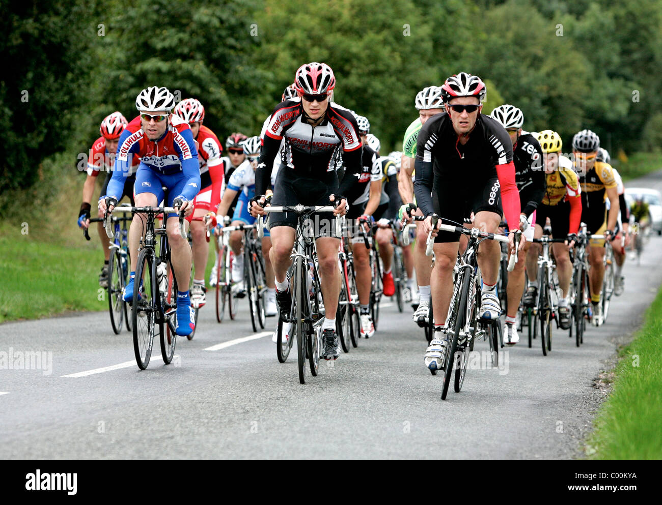 Cyclists race through the lanes of Worcestershire during a 3rd and 4th cat BCF road race. Stock Photo