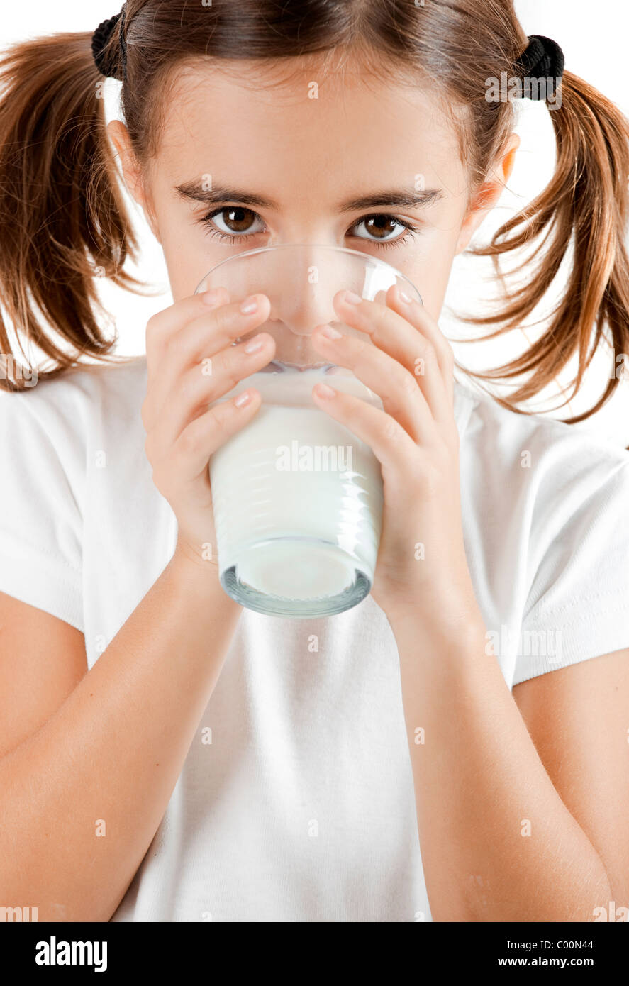 Portrait of a little girl drinking a cup of milk Stock Photo Alamy