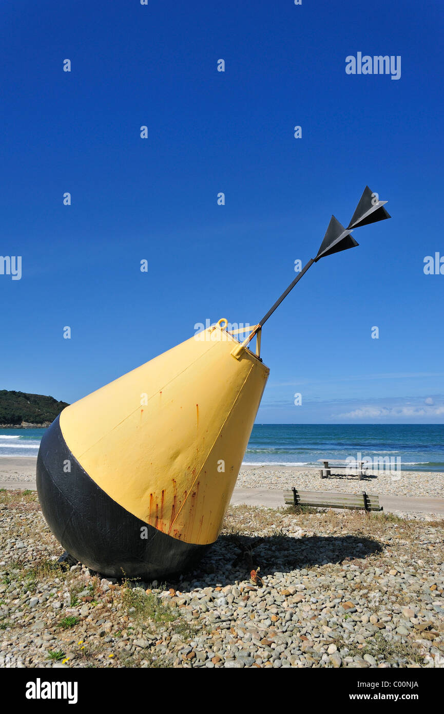 Big yellow buoy on beach at Brittany, France Stock Photo