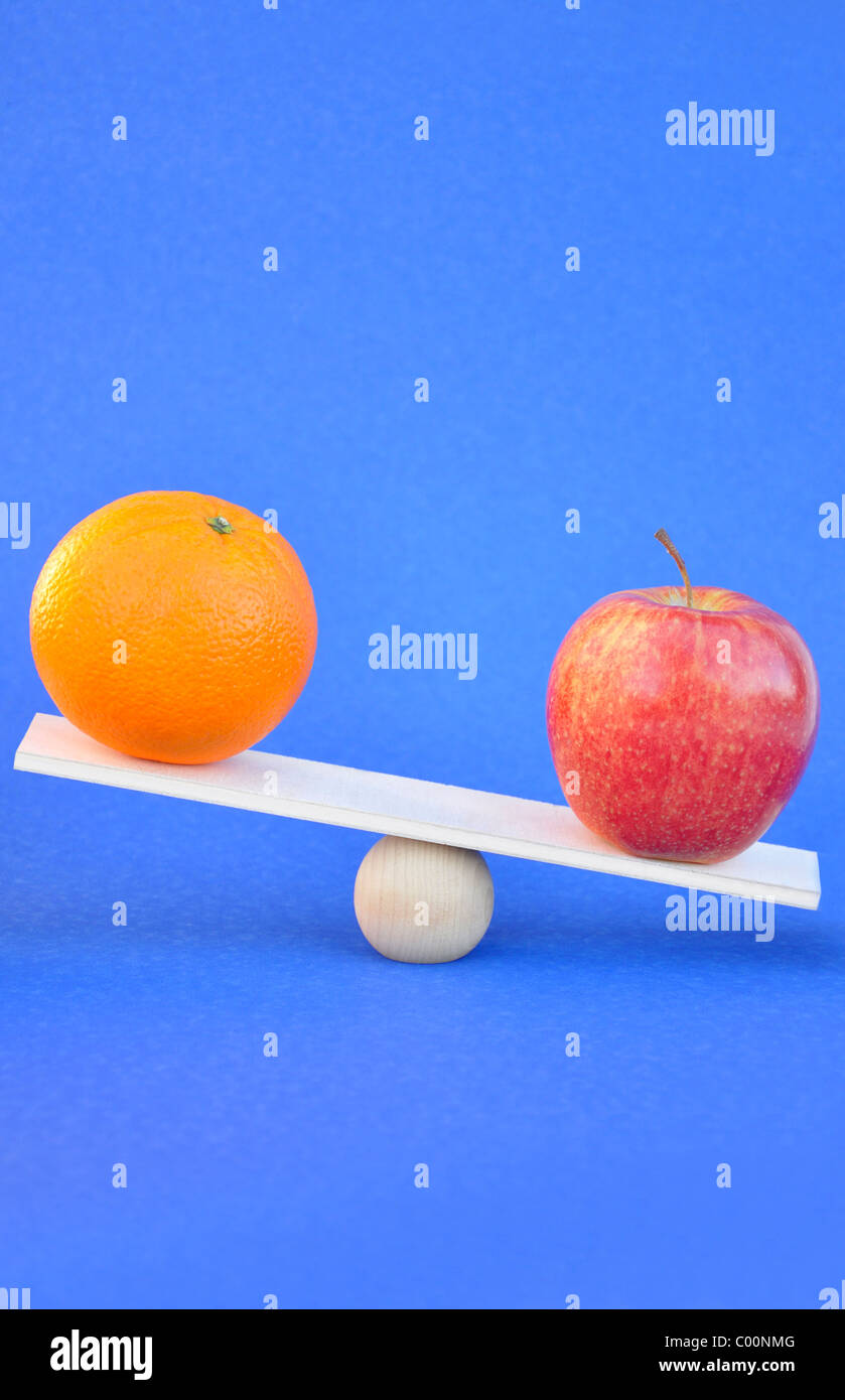 Apples and oranges comparison concept Stock Photo