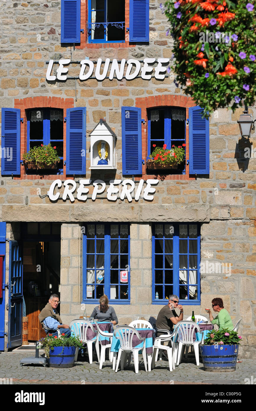 Tourists on terrace eating crepes at crêperie in Paimpol, Côtes-d'Armor, Brittany, France Stock Photo