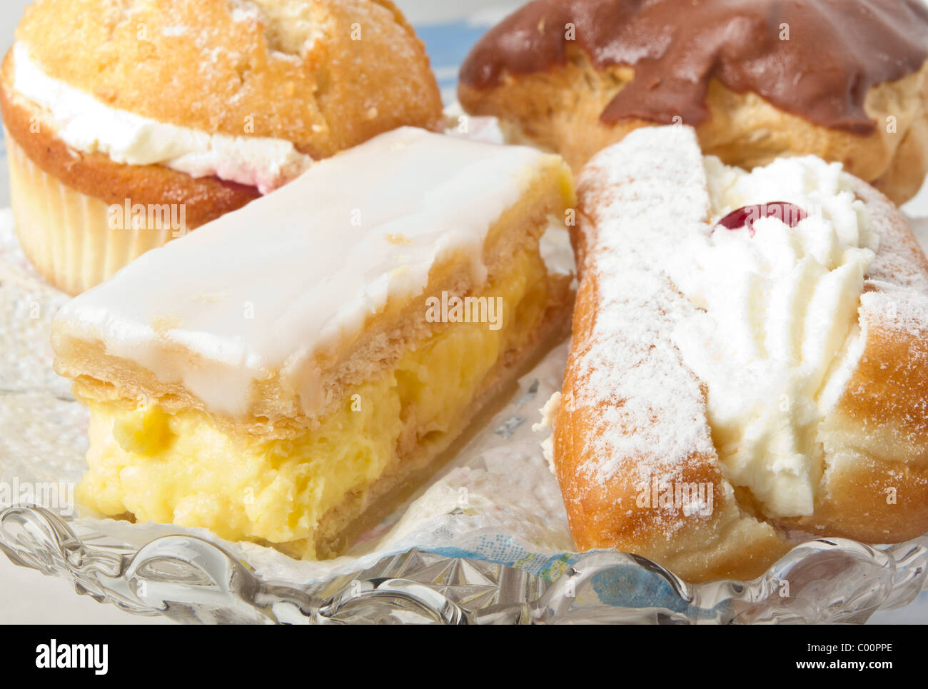 Close up of afternoon tea cream cakes selection. Stock Photo