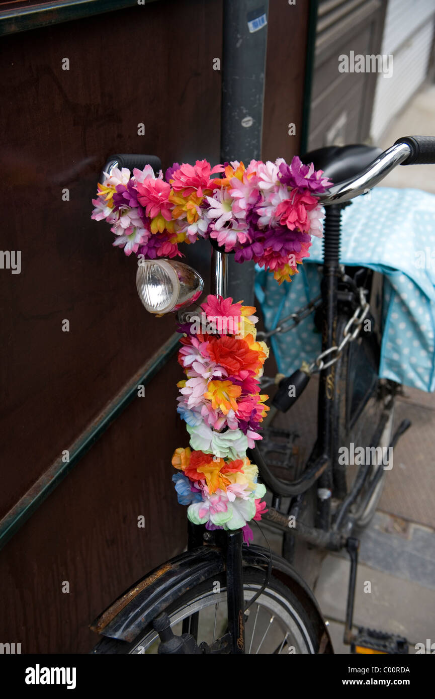 Ghent in East Flanders-Oost-Vlaanderen, Belgium. Flowers on a bike. Stock Photo