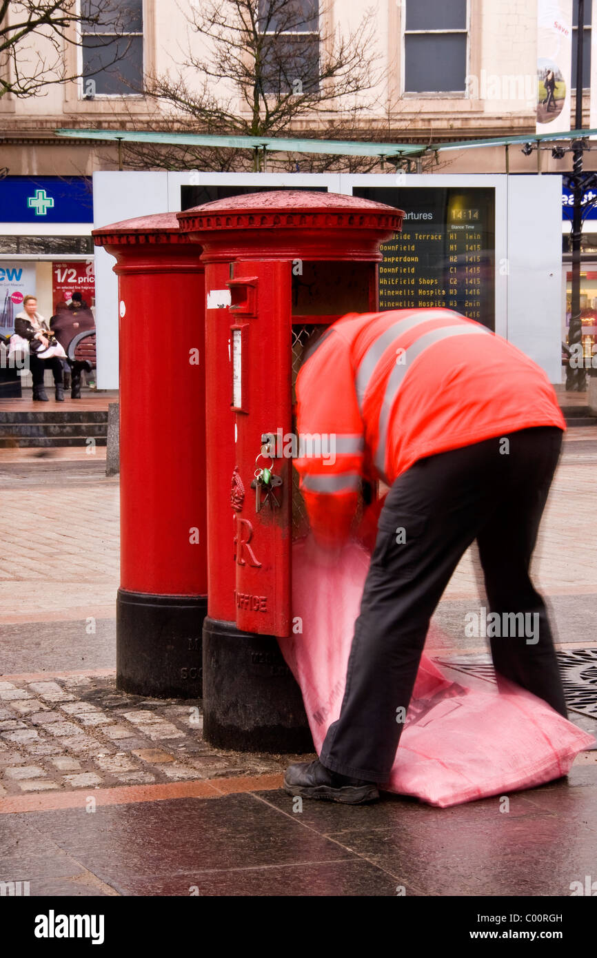 Royal Mail postman collecting the afternoon post in Dundee.UK Stock