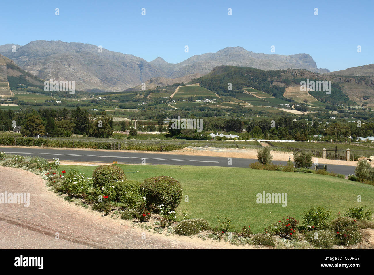 View over valley with winery in foreground in Franschoek, South Africa Stock Photo