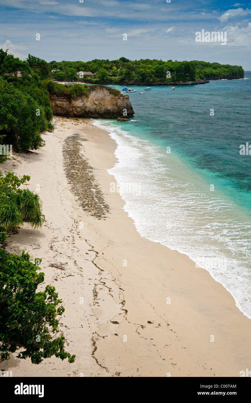 Mushroom Bay is a beautiful secluded white sand beach on Nusa Lembongan, a short distance from mainland Bali, Indonesia. Stock Photo